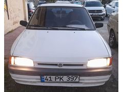 MAZDA 323 OTOMATİK-1.6-16 V.1992 MODEL.