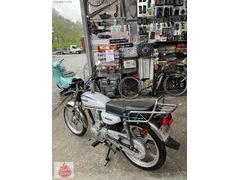 KARDEŞLER MOTORSIKLETTEN 50 CC B EHLIYETI SÜRER YINEN CG 50