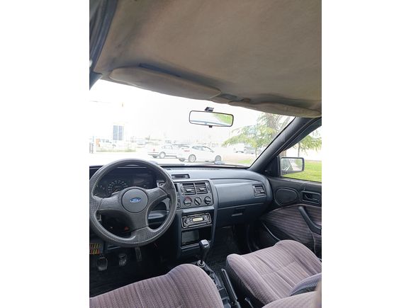 SSS CARS TAN 1995 MODEL FORD-ESCORT