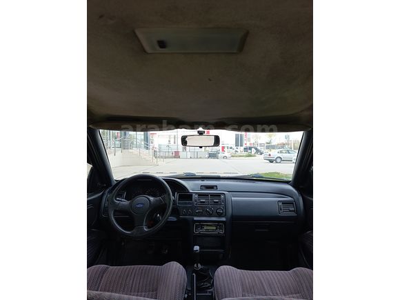 SSS CARS TAN 1995 MODEL FORD-ESCORT