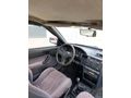 SSS CARS TAN 1995 MODEL FORD-ESCORT