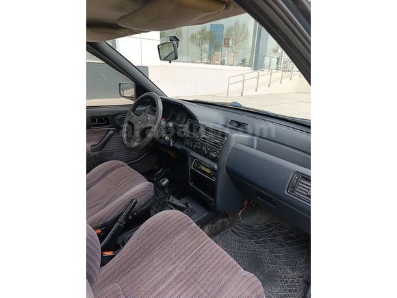 SSS CARS TAN 1995 MODEL FORD-ESCORT