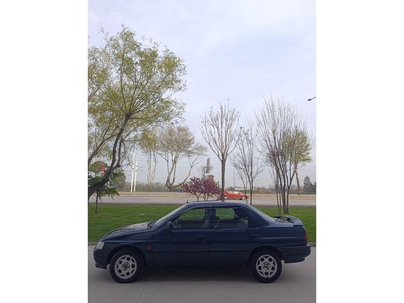 SSS CARS TAN 1995 MODEL FORD-ESCORT