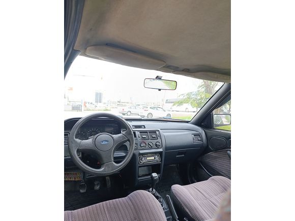 SSS CARS TAN 1995 MODEL FORD-ESCORT