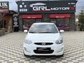GRL MOTORS'TAN 88.000 ACCENT BLUE