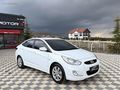 GRL MOTORS'TAN 88.000 ACCENT BLUE