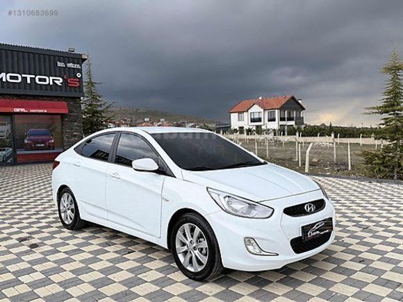 GRL MOTORS'TAN 88.000 ACCENT BLUE