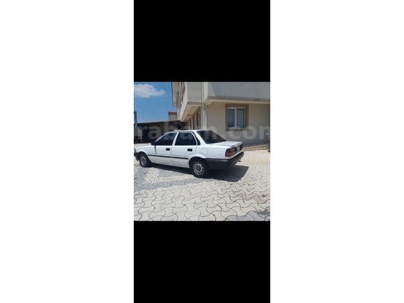 DEGISENSIZ   HIDROLIK VE. KLIMA VAR DÜŞÜK  KM LI  TOYATA CORALLA 1.6.