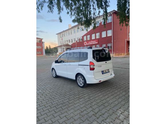 OTOMOBİL RUHSATLI 65 KM  DE HATSIZ BOAYSIZ Titanium Plus TUTULANI   