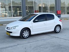 ŞENTÜRKLERDEN DÜŞÜK KM BAKIMLI KLİMALI 206 ÖZEL PLAKALI