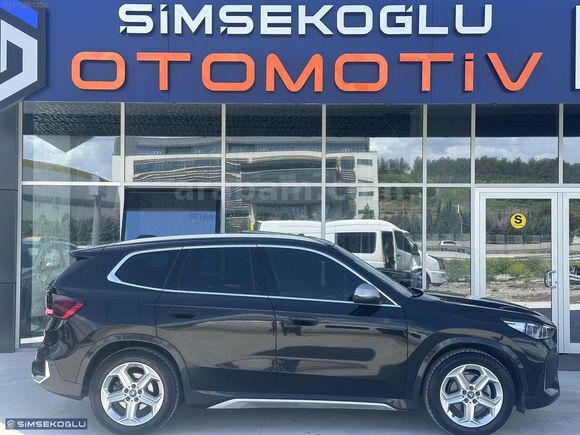 ŞİMŞEKOĞLU'DAN 2024 BMW İX1 HATASIZ TRAMERSİZ MOCHA DERİ %20 KDV