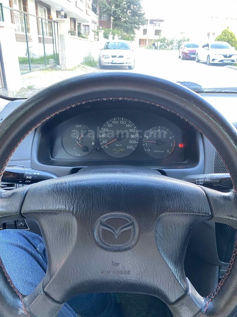 MEMURDAN TEMİZ MAZDA 323 7