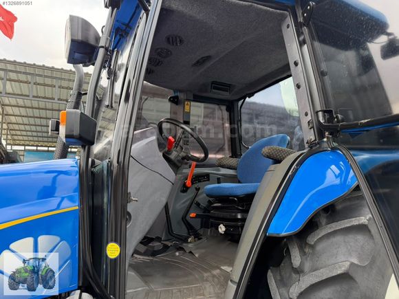 DEVTRAK'TAN NEW HOLLAND TL 100 A 2008 MODEL 5500 SAATTE