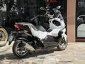 MOTOMAS' tan ADX 125