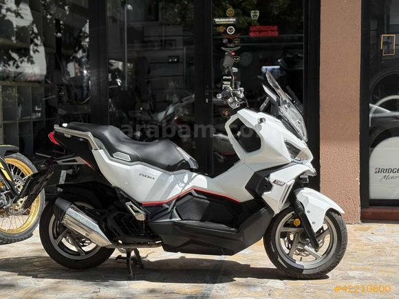 MOTOMAS' tan ADX 125