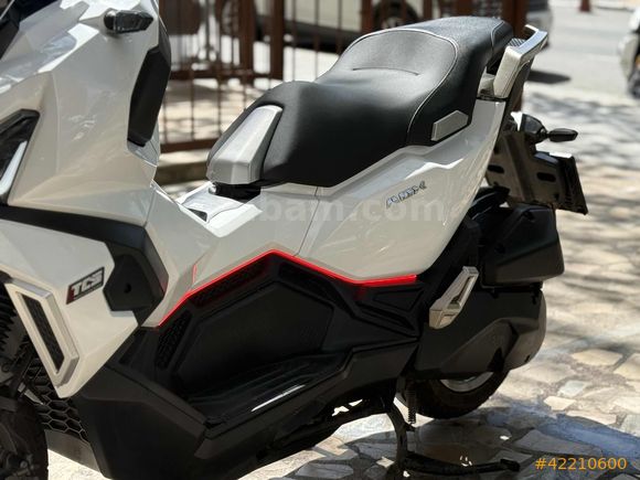 MOTOMAS' tan ADX 125