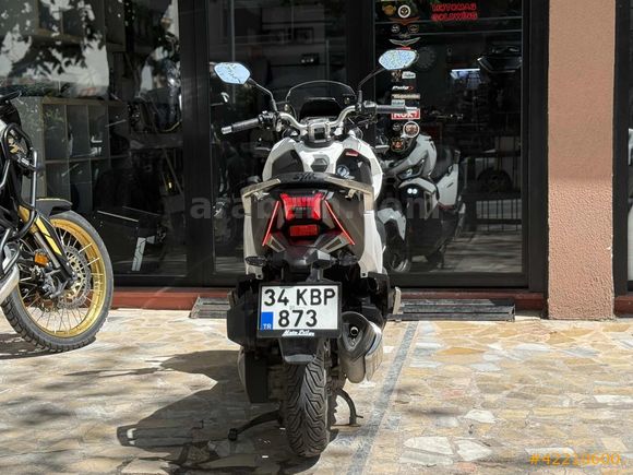 MOTOMAS' tan ADX 125