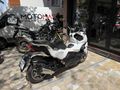 MOTOMAS' tan ADX 125