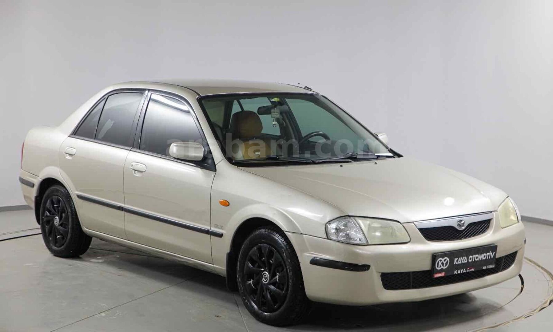 Galeriden Mazda 323 1.5 i 1999 Model Osmaniye 309.000 km Kahverengi 1