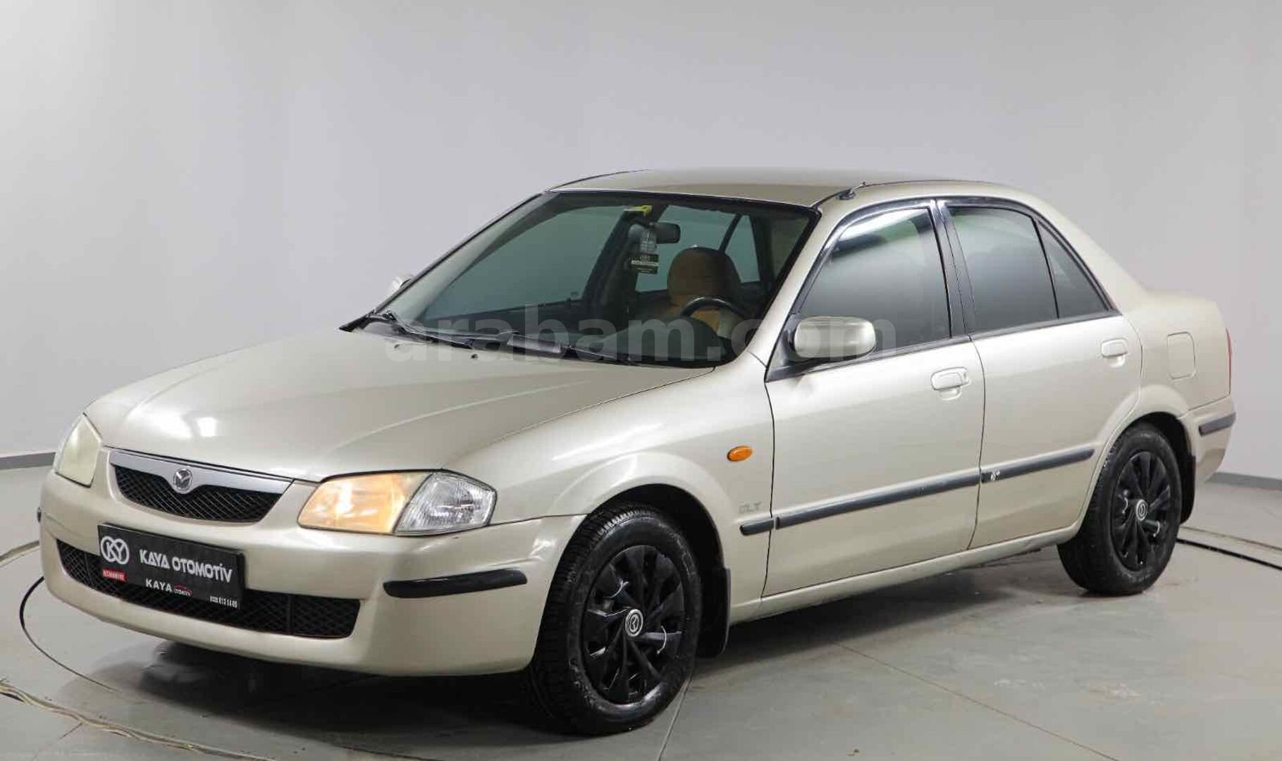 Galeriden Mazda 323 1.5 i 1999 Model Osmaniye 309.000 km Kahverengi 3