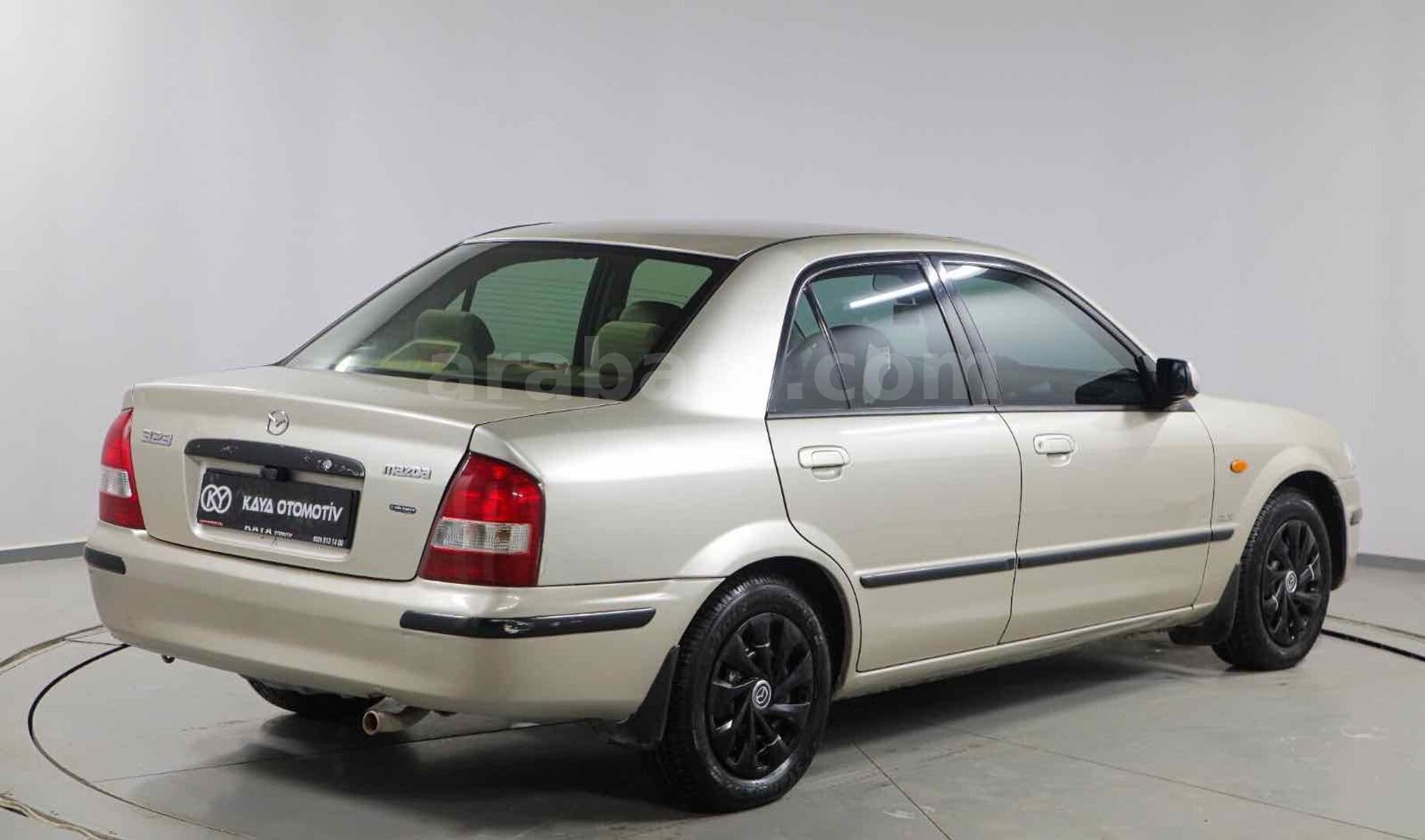 Galeriden Mazda 323 1.5 i 1999 Model Osmaniye 309.000 km Kahverengi 6