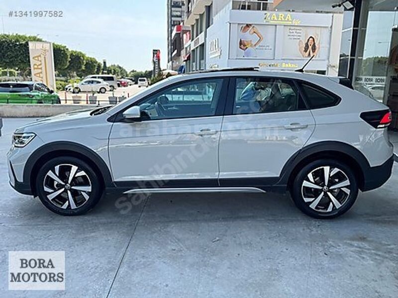 BORA MOTORS 2025 TAİGO 1.0TSİ STYLE 13.500Km CAMTAVAN+ACC BOYASZ 7